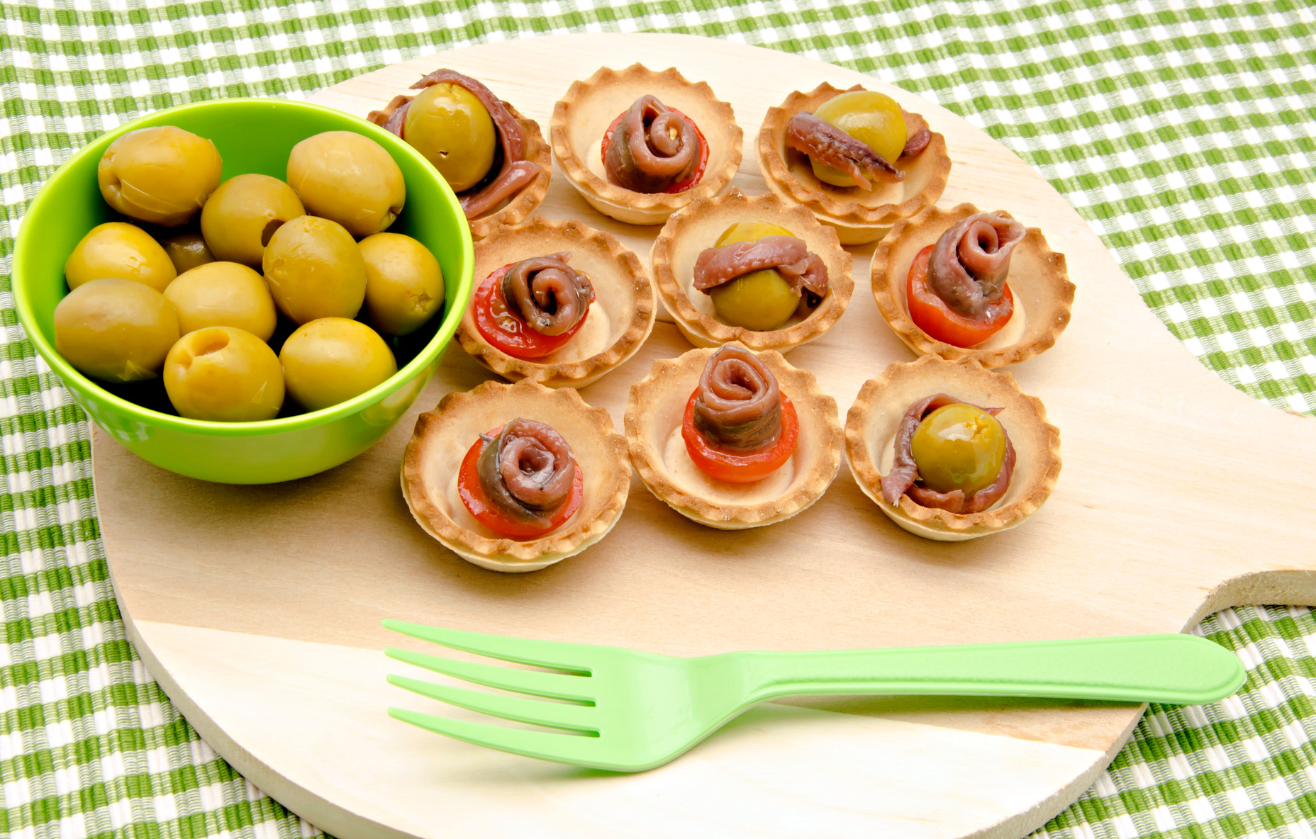 Snacks of olives, anchovies and tomatoes